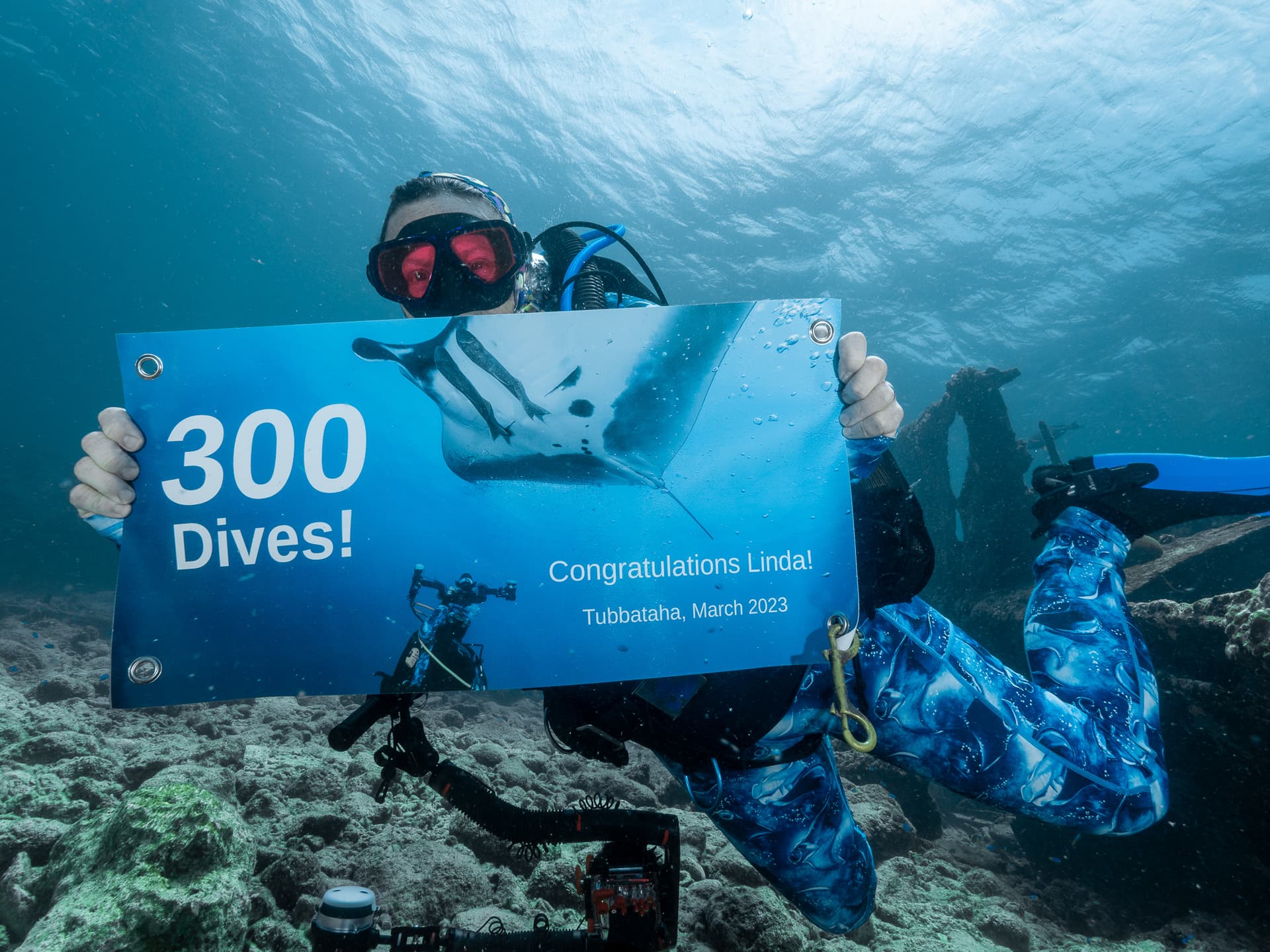 Linda with 300 dive sign